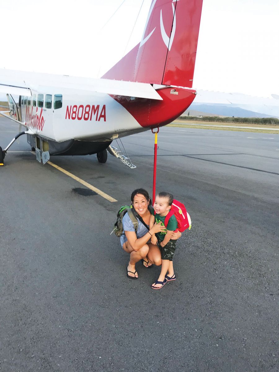 mom and son in front of plane molokai hawaii