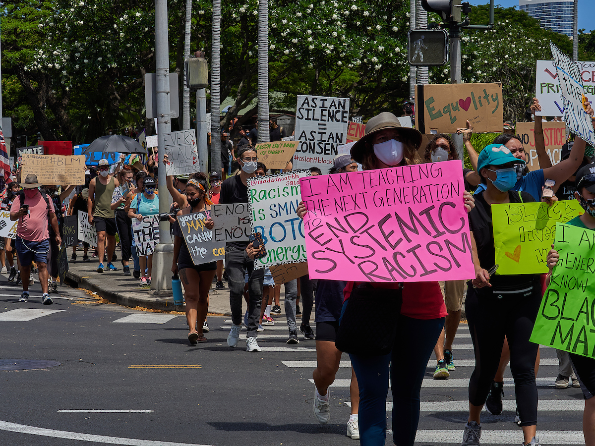  /><figcaption>The historic march was captured by one of our favorite staff photographers, David Croxford, who also happened to retire this year. Mahalo David!<br />
<em>Photo: David Croxford</em></figcaption></figure>
</div>
<p>In response to systematic racism and growing occurrences of police brutality throughout the nation, thousands of Hawaiʻi residents showed their support for the Black Lives Matter movement by taking to the streets last June. Wearings masks and holdings signs that read, “Silence is Violence,” “Defund the Police,” “End Systemic Racism” and “Black Lives Matter,” one of the largest community-led protests moved from Ala Moana Beach Park to the Hawaiʻi State Capitol Building. And unlike many other protests occurring throughout the United States, Hawaiʻi’s was entirely peaceful—with police officers and the public working together to make the historic occasion a nonviolent one.</p>
<p><strong>READ MORE</strong>: <a href=