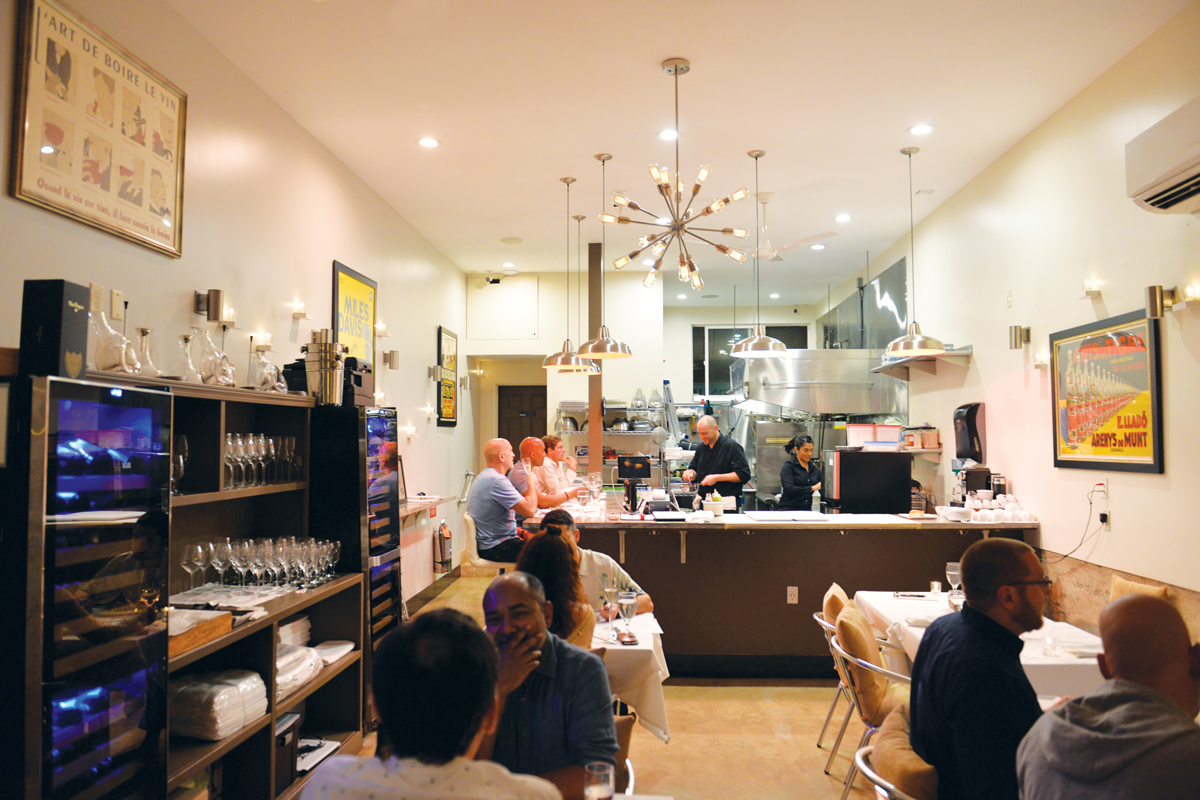  /><figcaption>With its 14-seat, one-room kitchen and dining area, Nylos is an intimate dining experience.<br />
<em>Photo: Heather Ellison</em></figcaption></figure>
</div>
<p><span data-contrast=