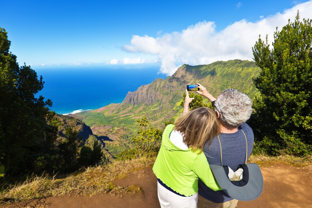 Tourist Couple At Waimea Canyon State Park Kalalau Beach, Kauai, Hawaii