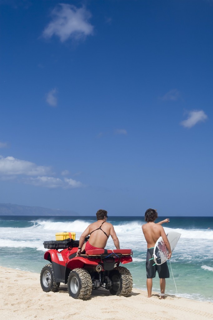 Lifeguard And Surfer On Beach