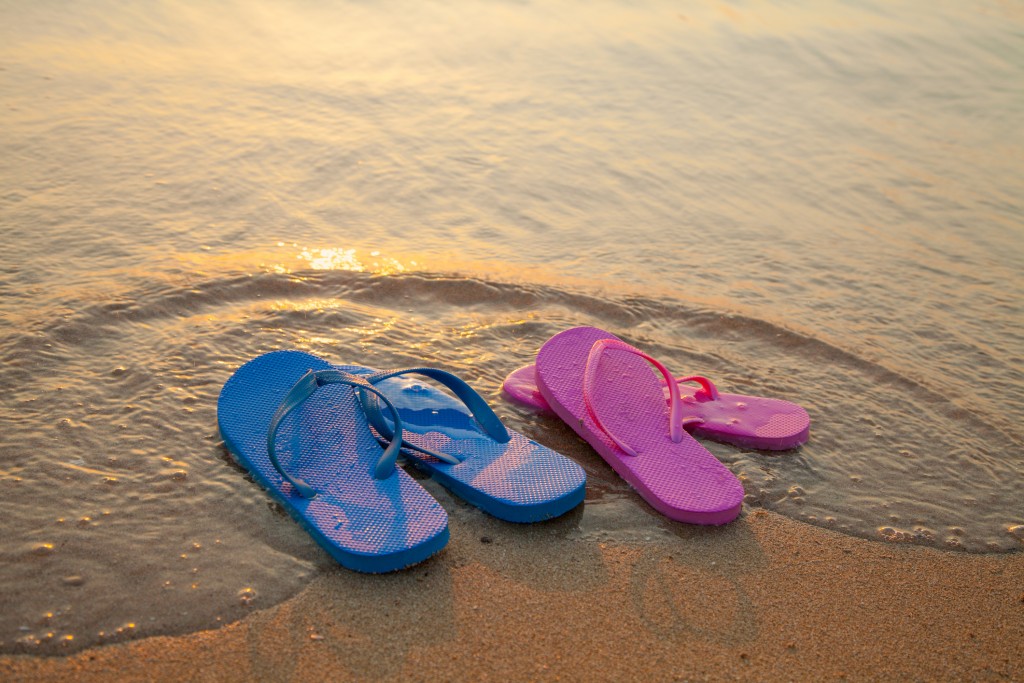 Female And Male Flip Flpp Sandals On The Beach
