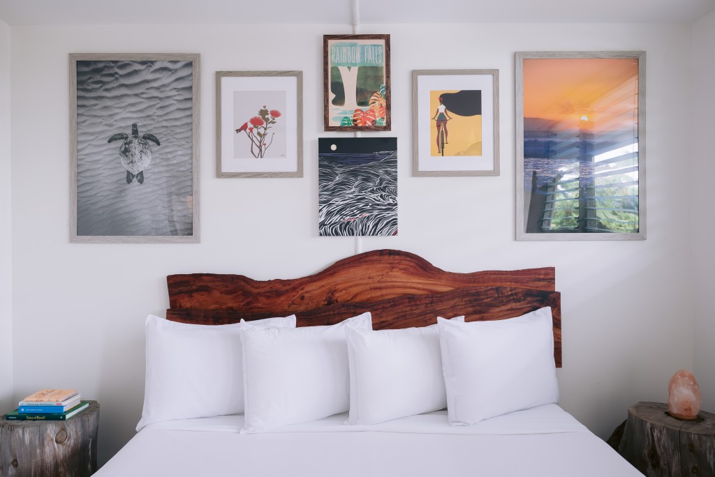 Room With Pics On Wall Courtesy Of Scp Hilo Hotel