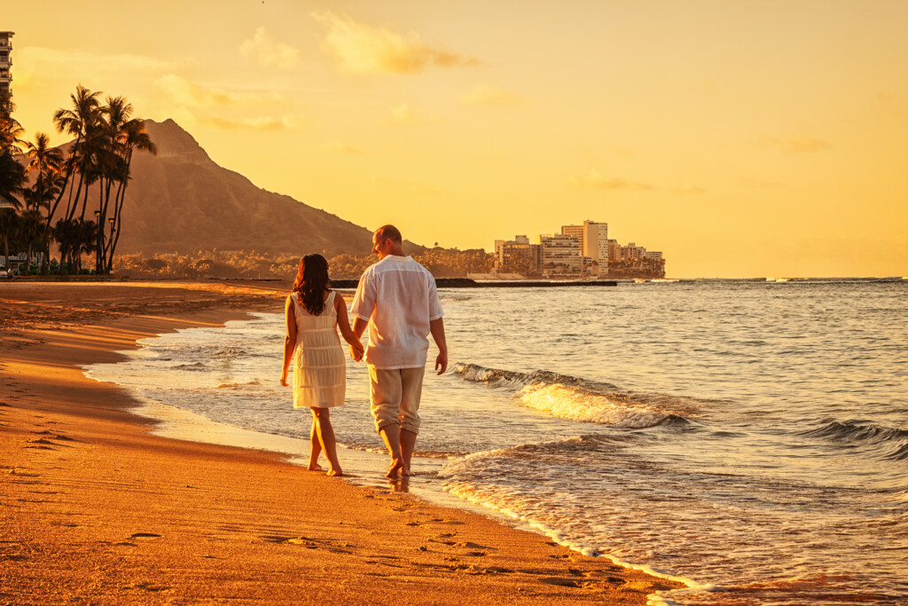 Happy Couple Walking On Waikiki Beach At Sunrise