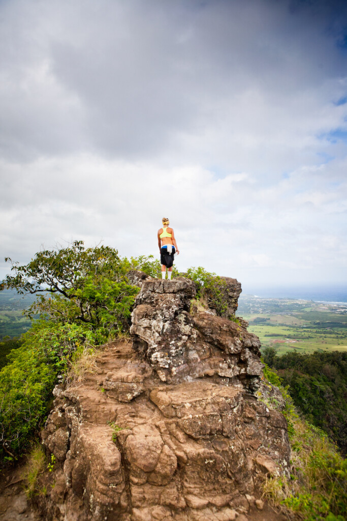 A Girl Reaches The Top Of The Mountain.