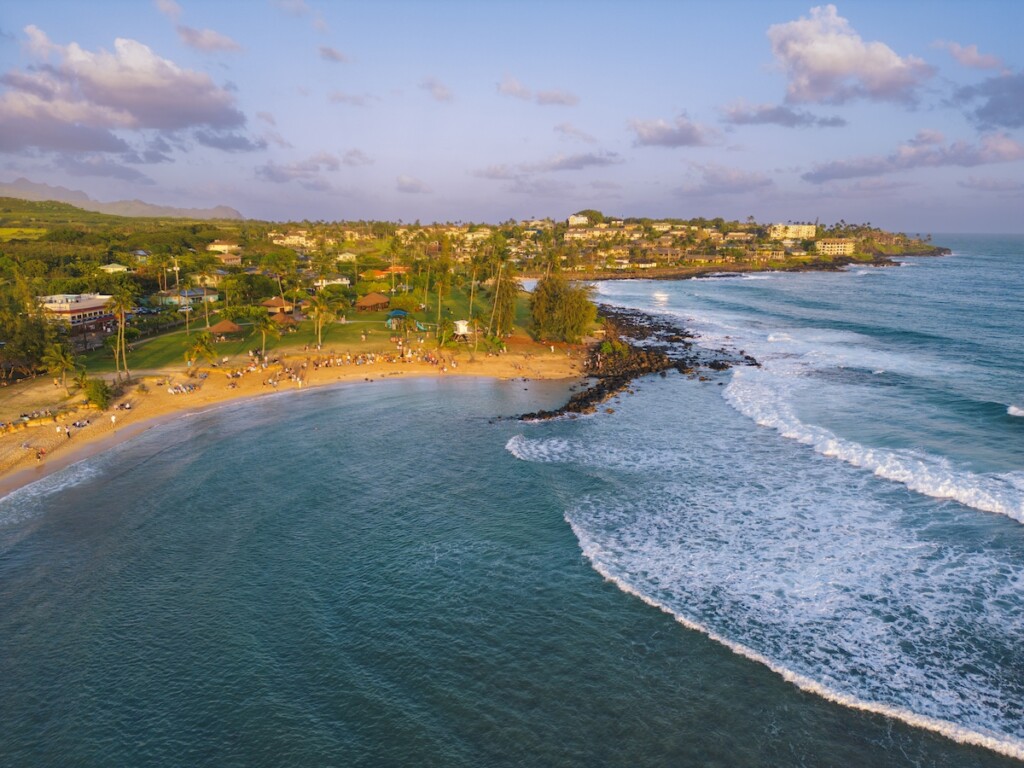 Aerial Of Poipu Beach During Sunset In Kauai Hawaii Usa
